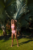 Pamela is our first mesh monokini which is a design innovation combining a bikini & a one piece swimsuit. A high waist bottom is paired with a bandeau bikini top with a  high collar. The rose pink color makes this mesh monokini a statement beachwear for women.
