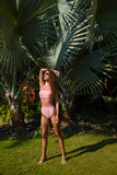 Pamela is our first mesh monokini which is a design innovation combining a bikini & a one piece swimsuit. A high waist bottom is paired with a bandeau bikini top with a  high collar. The rose pink color makes this mesh monokini a statement beachwear for women.